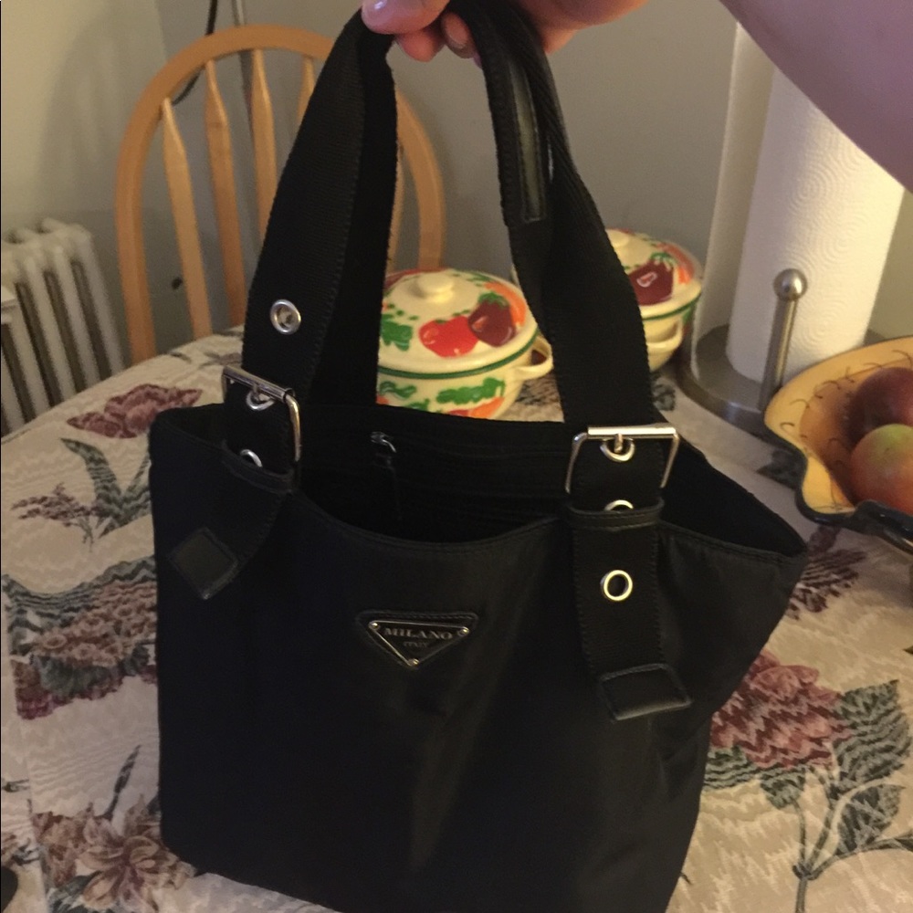 Milano gently purse